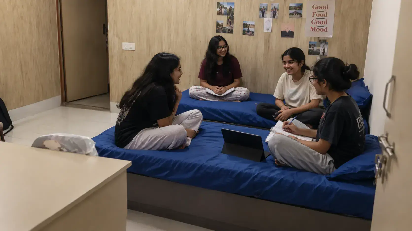 Indian high school boarding students laughing and connecting in residential common lounge at Mirai Experiential School